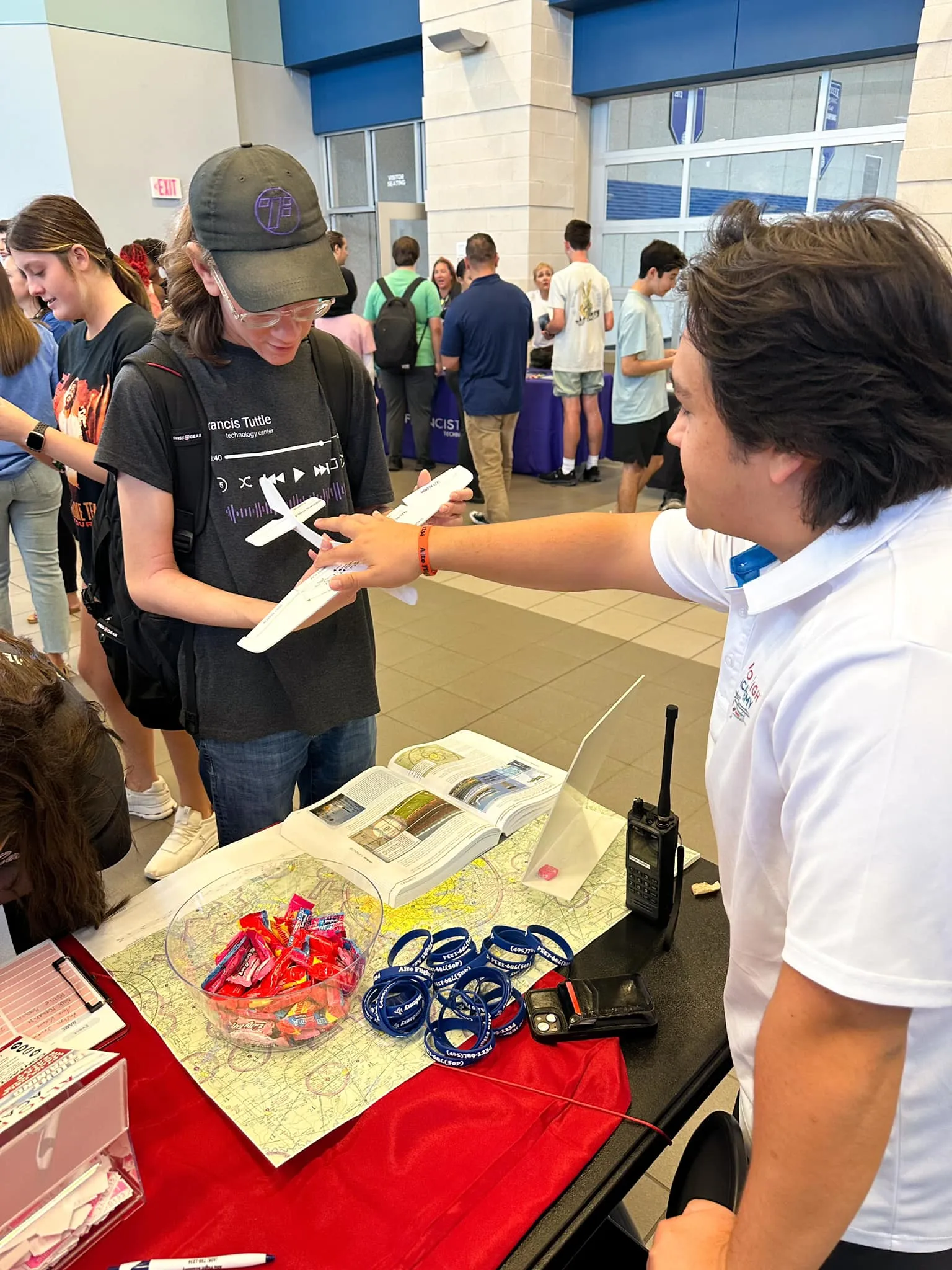 CFI showing airplane model to interested student pilot