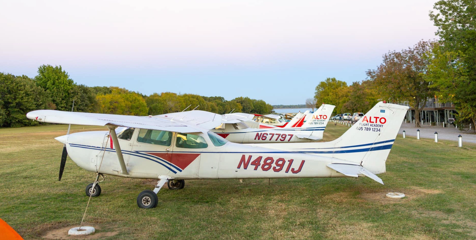 Alto Flight Academy fleet of aircraft on grass airport Cedar Mills