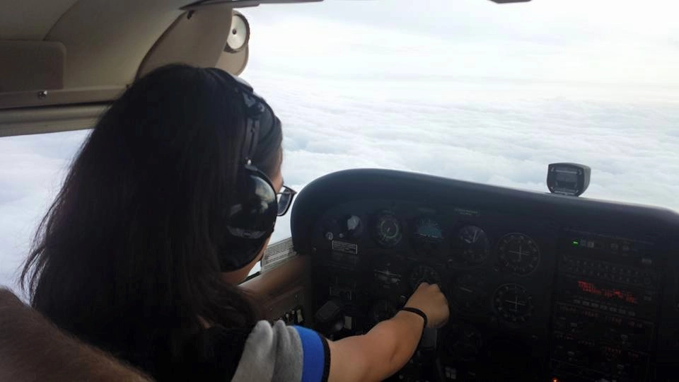 Pilot flying above clouds over Bethany, Oklahoma