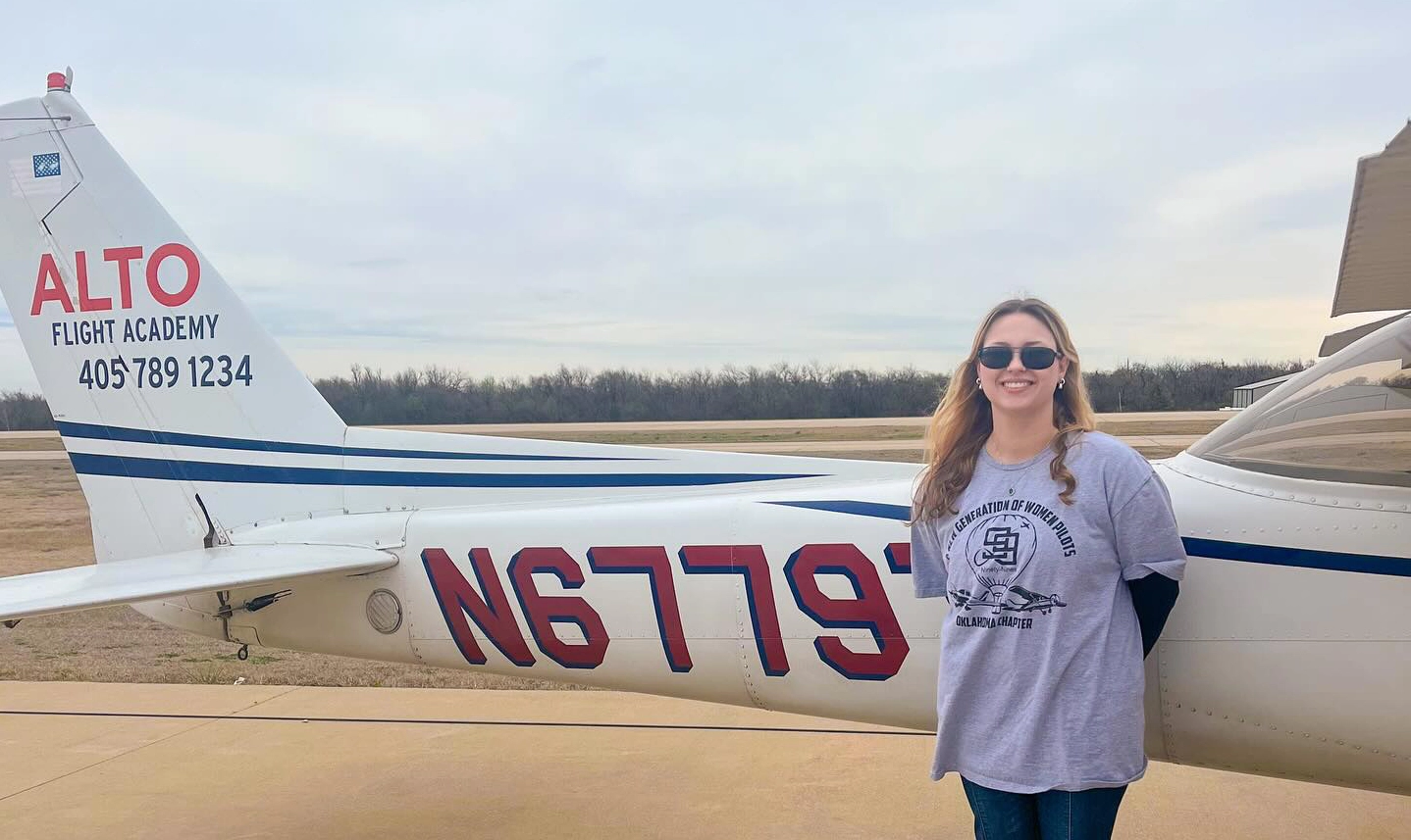 An Alto Flight Academy private pilot student at Sundance Airport in front of a cessna 172 at Sundance Airport