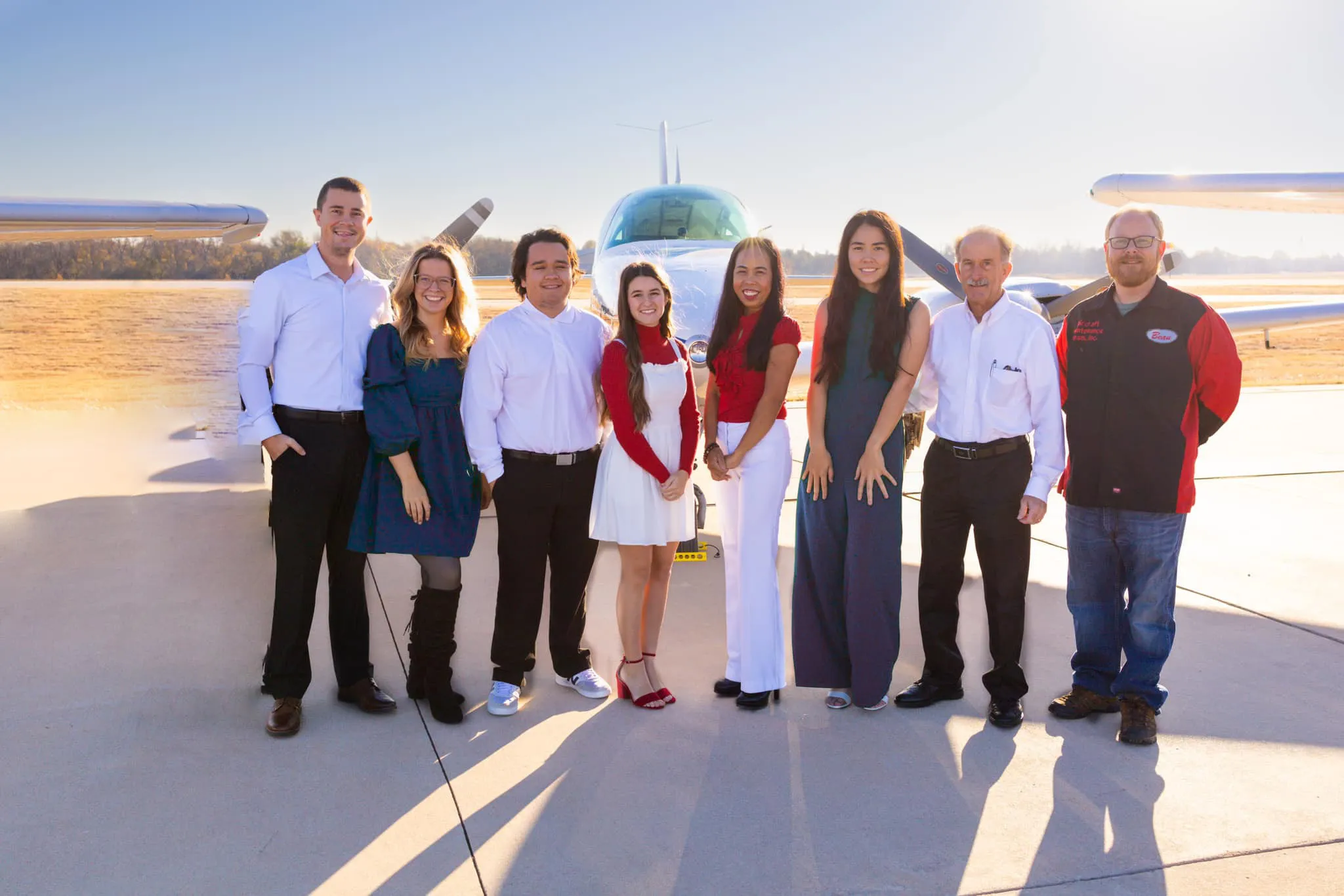 Alto Flight Academy team in front of multi engine airplane at Sundance Airport KHSD